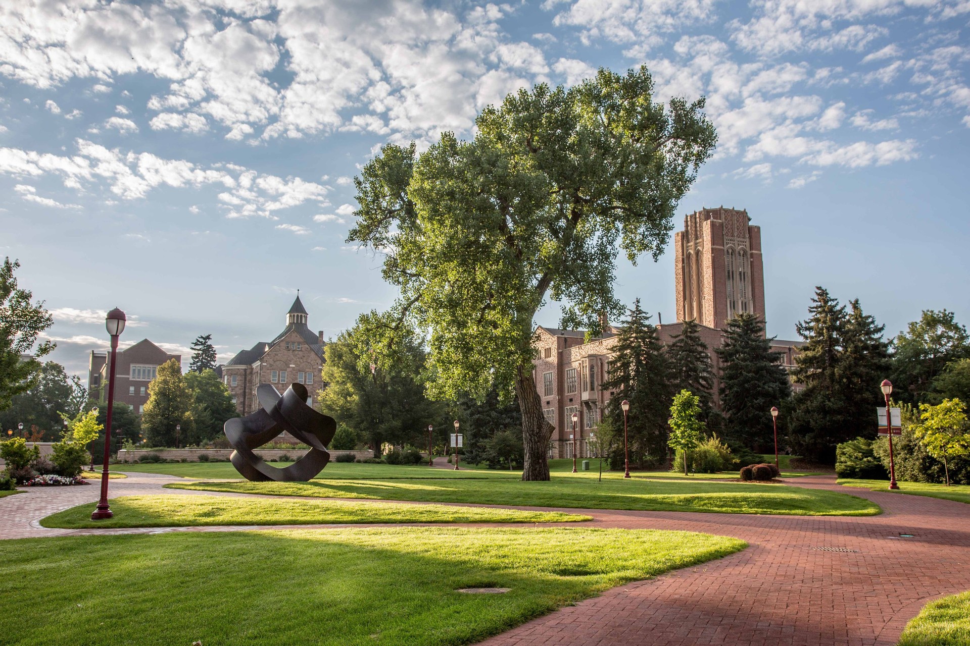 Red brick paths and grassy quads line the campus of University of Denver