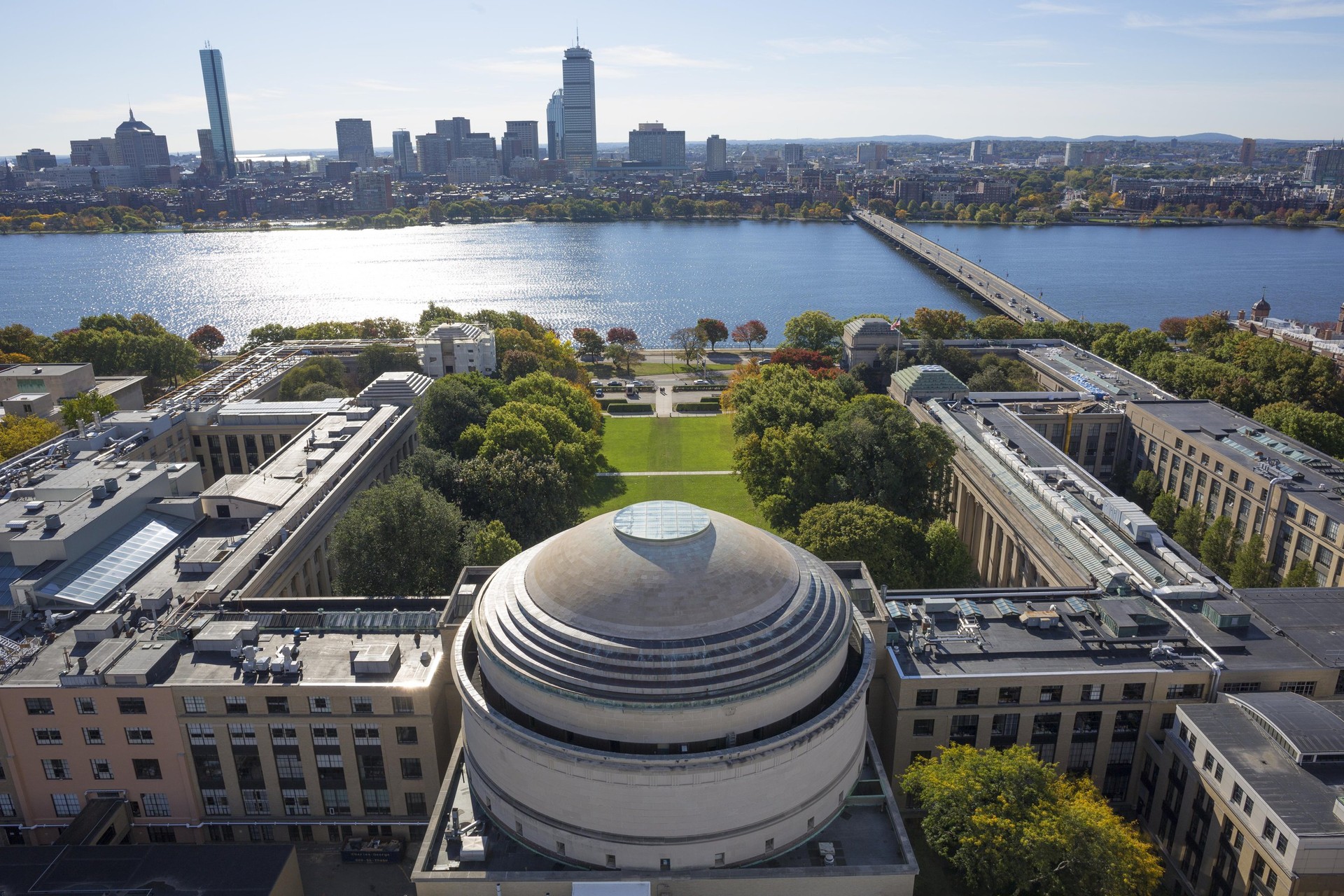 Bird's eye view of MIT University's Great Dome with the Charles River and Harvard Bridge in the background
