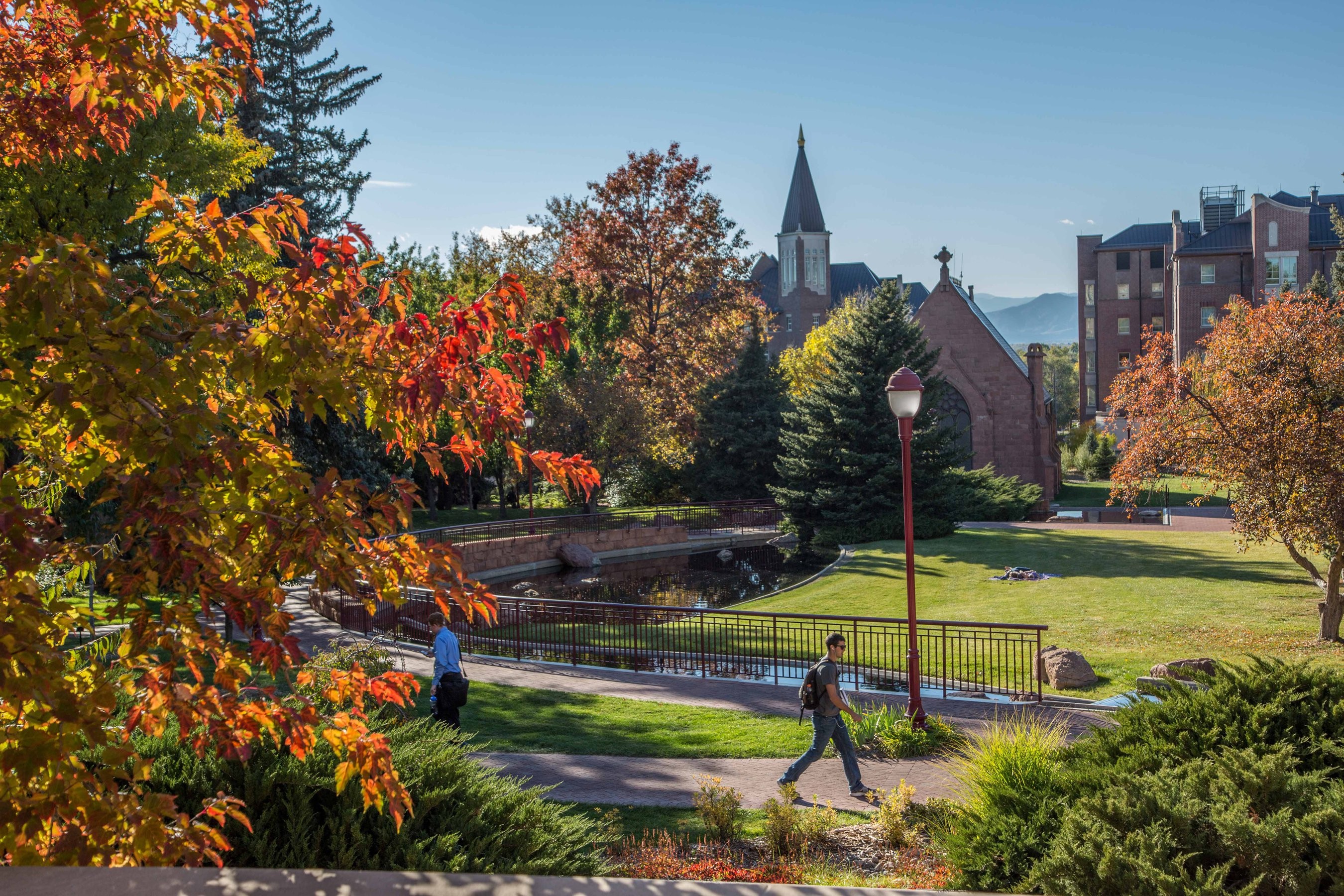 University of Denver students walking across campus on a sunny fall day