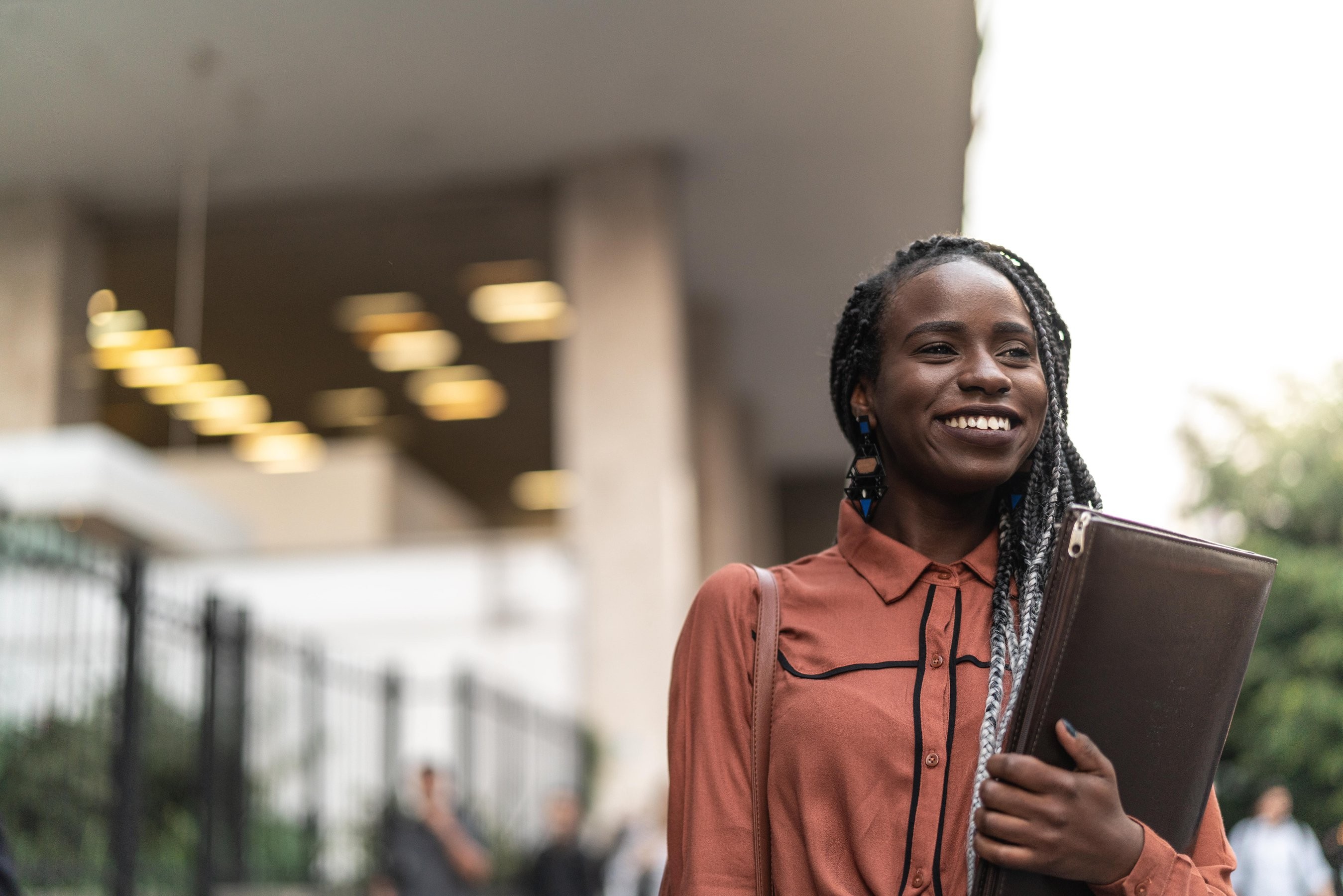 Female student holding a leather case at the University of London