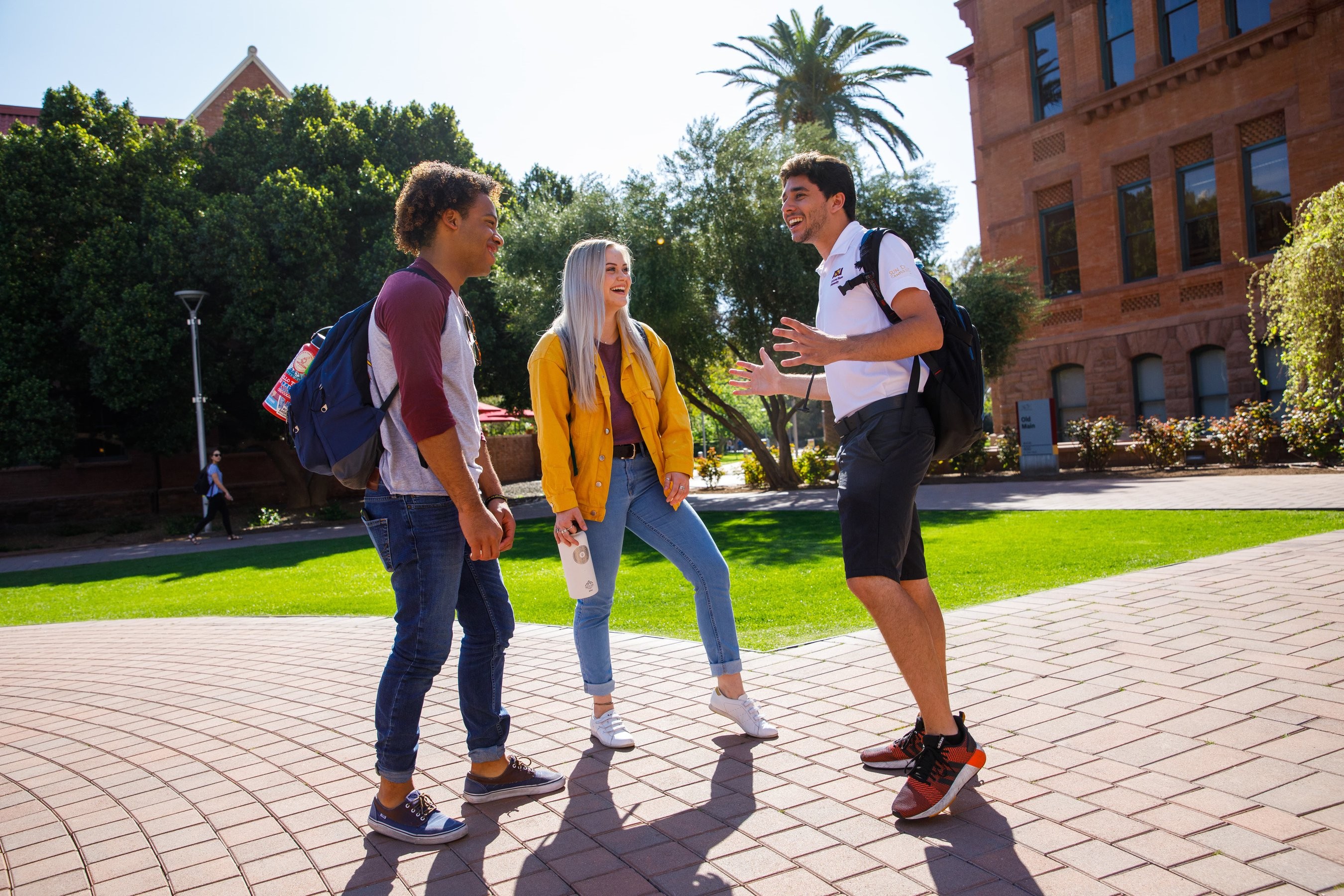 Arizona State University students talking on a quad
