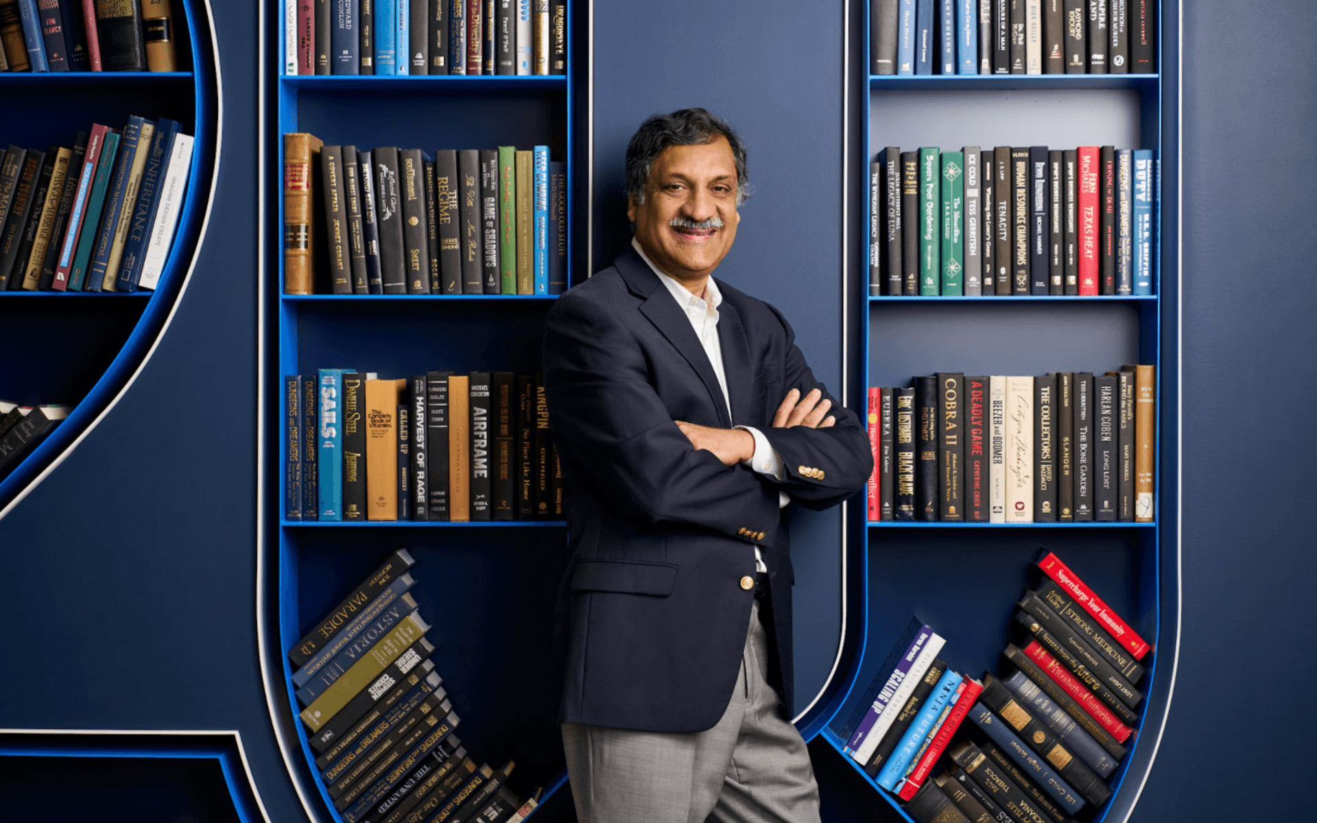 Anant Agarwal in front of a bookcase