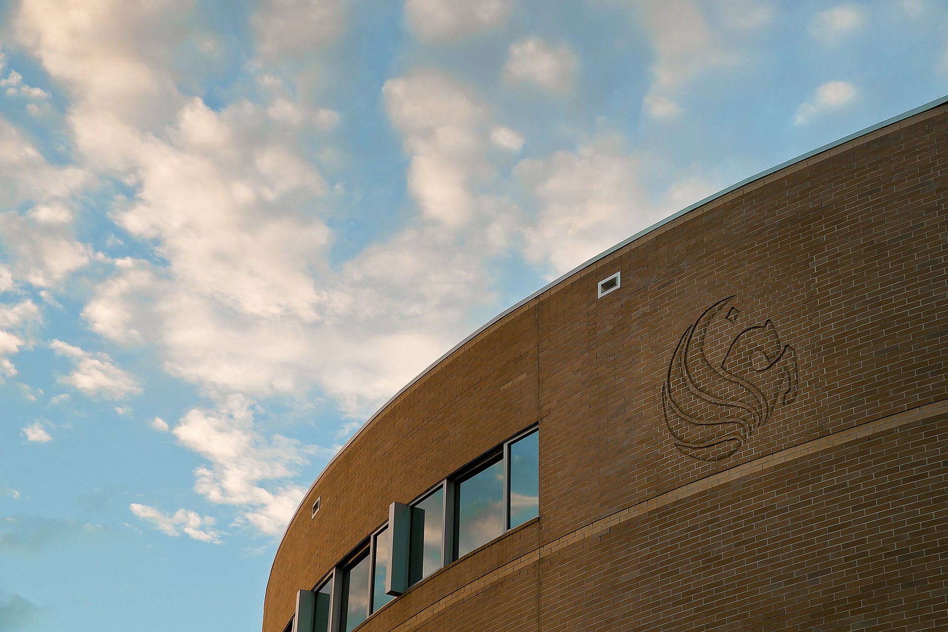 Up close image of the UCF logo on a campus building